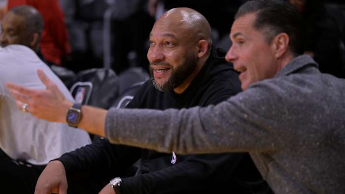 Los Angeles Lakers head coach Darvin Ham talks with general manager Rob Pelinka.